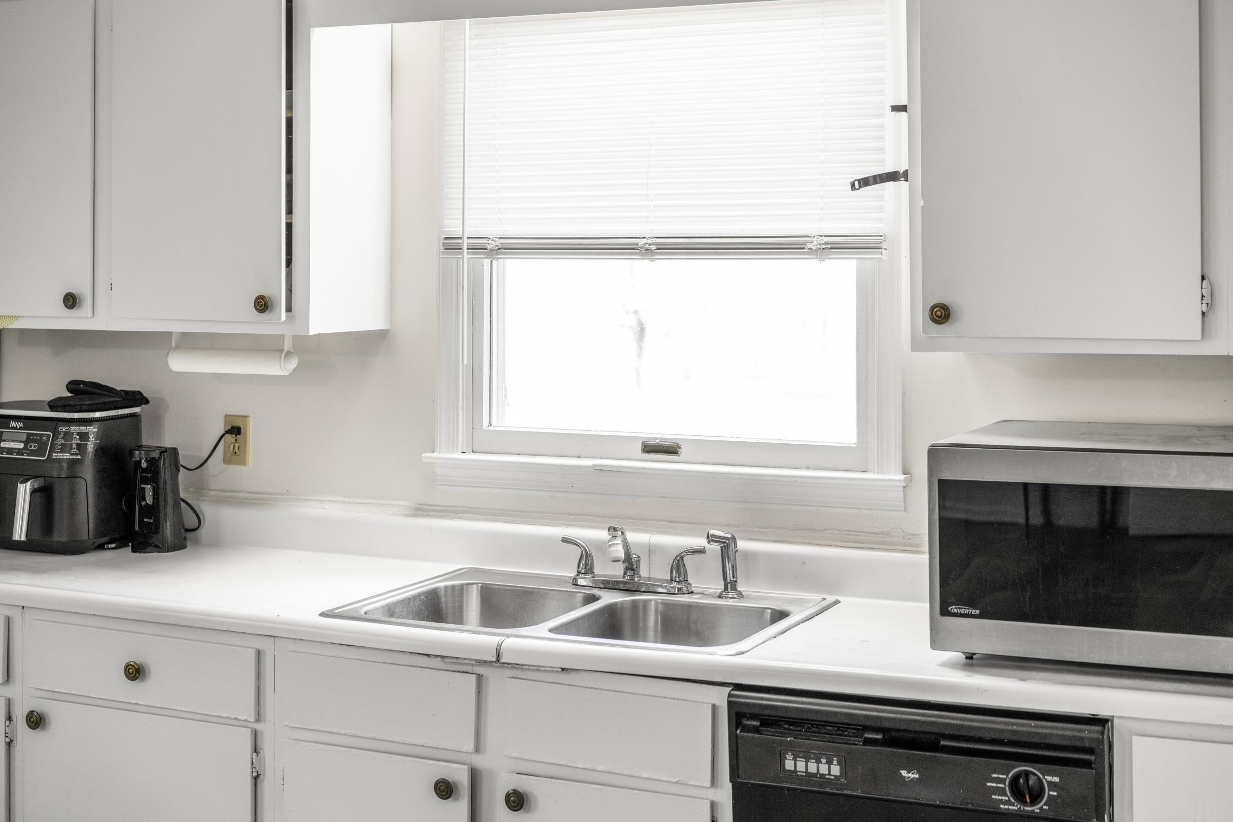 1316 East Main Street Waynesboro, VA 22980 - Photo 18 of 34 a kitchen with a sink and a microwave