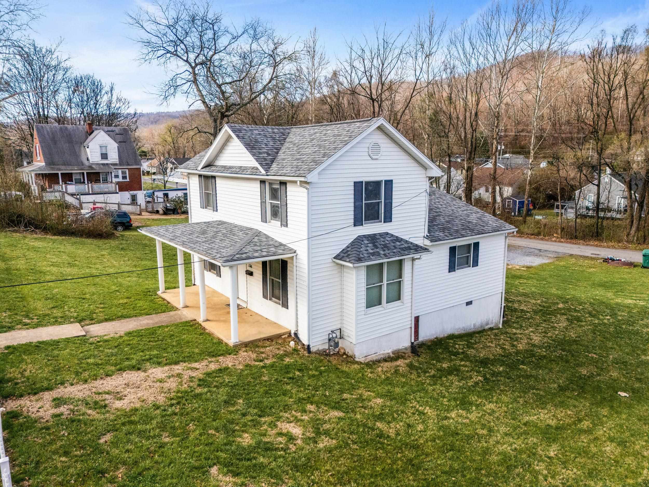 1316 East Main Street Waynesboro, VA 22980 - Photo 2 of 34 a front view of a house with garden