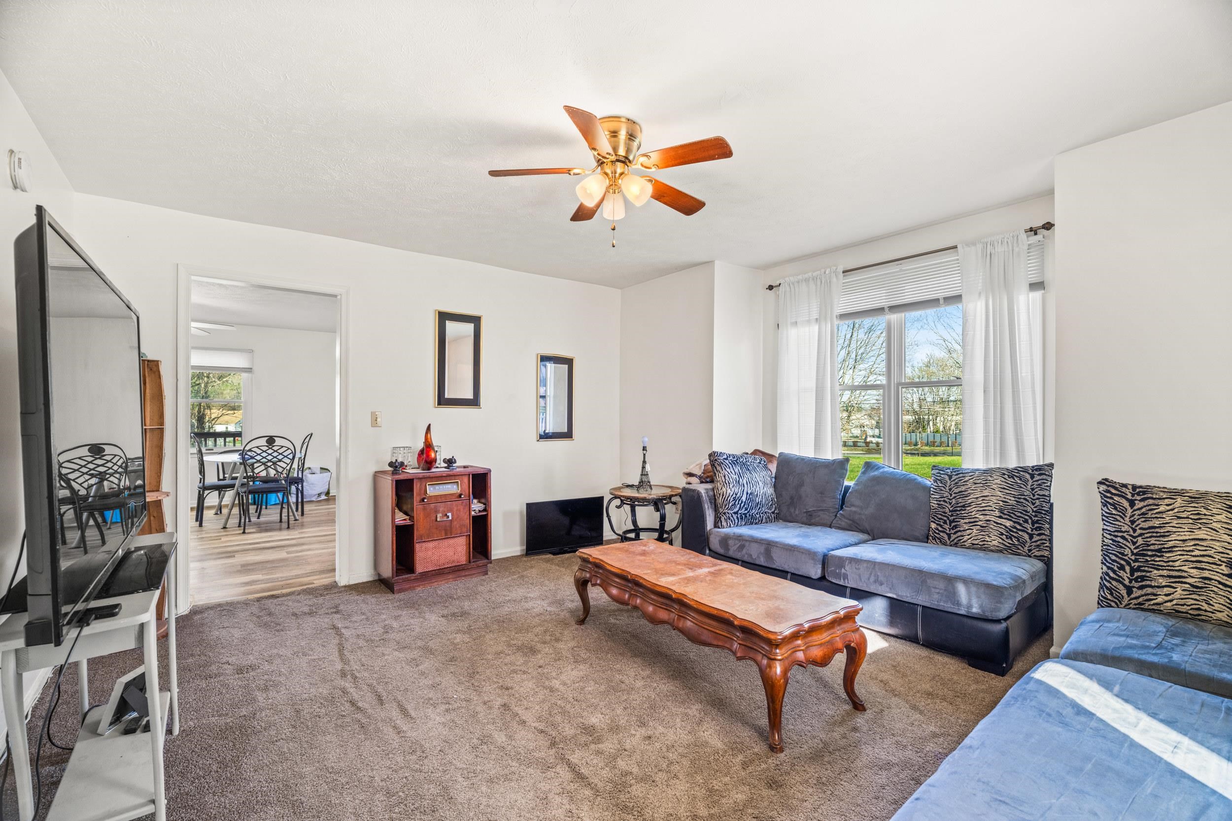 1316 East Main Street Waynesboro, VA 22980 - Photo 22 of 34 a living room with furniture and a window