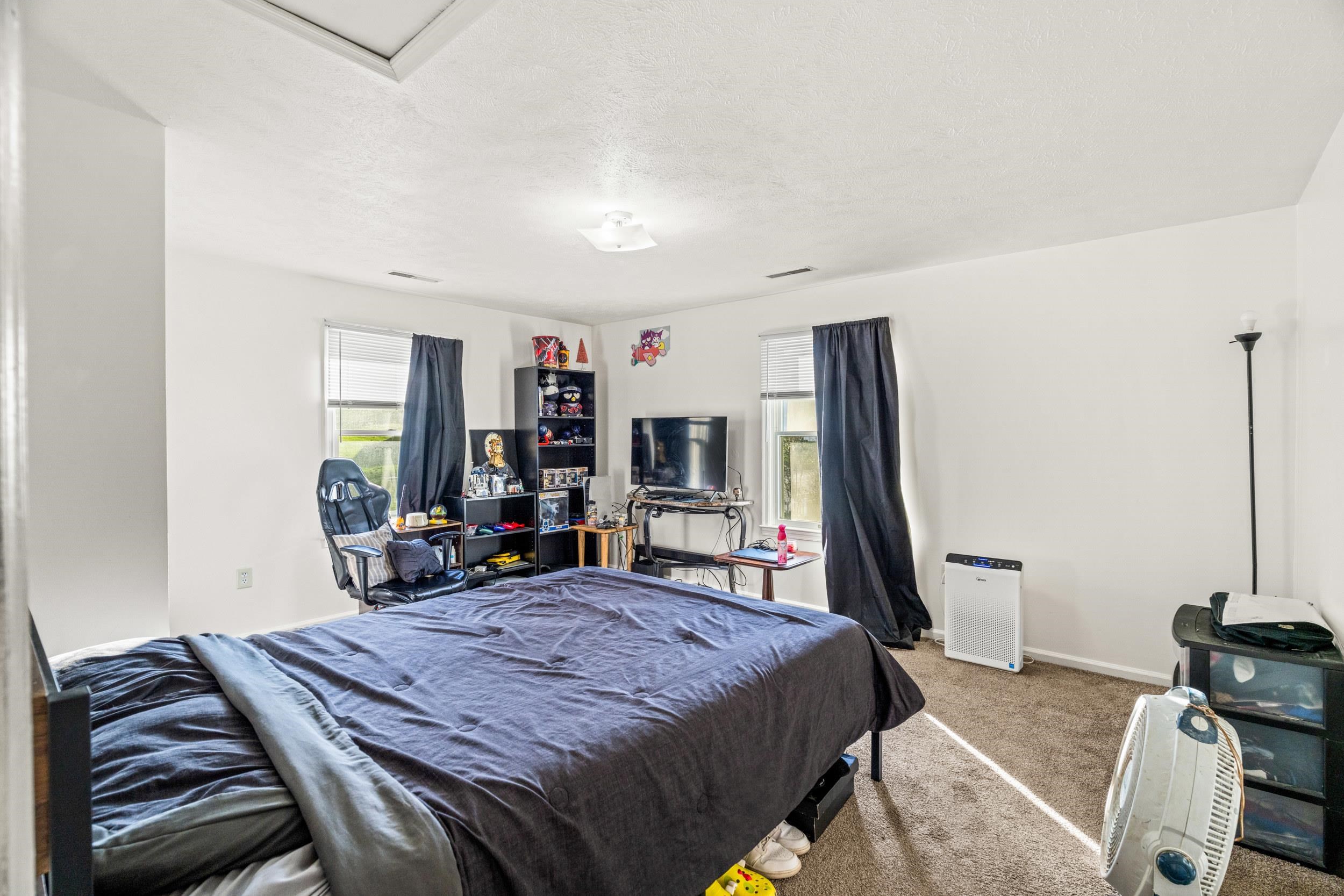 1316 East Main Street Waynesboro, VA 22980 - Photo 29 of 34 a bed room with a bed and a television