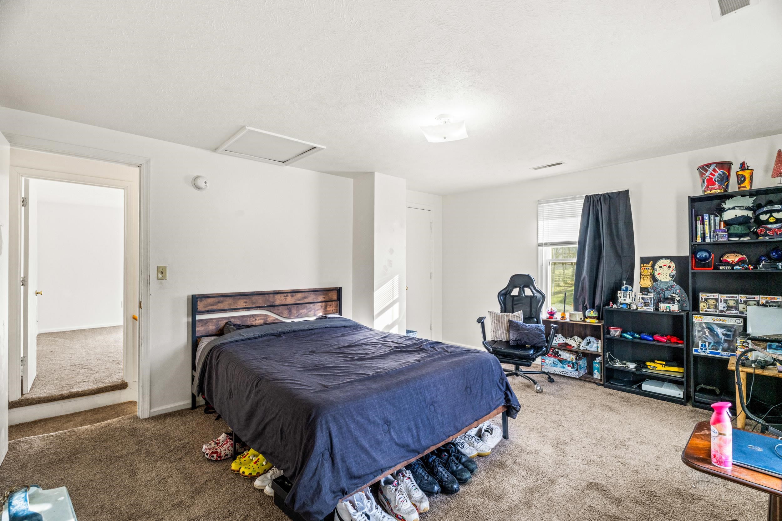 1316 East Main Street Waynesboro, VA 22980 - Photo 30 of 34 a bedroom with bed and a bookshelf