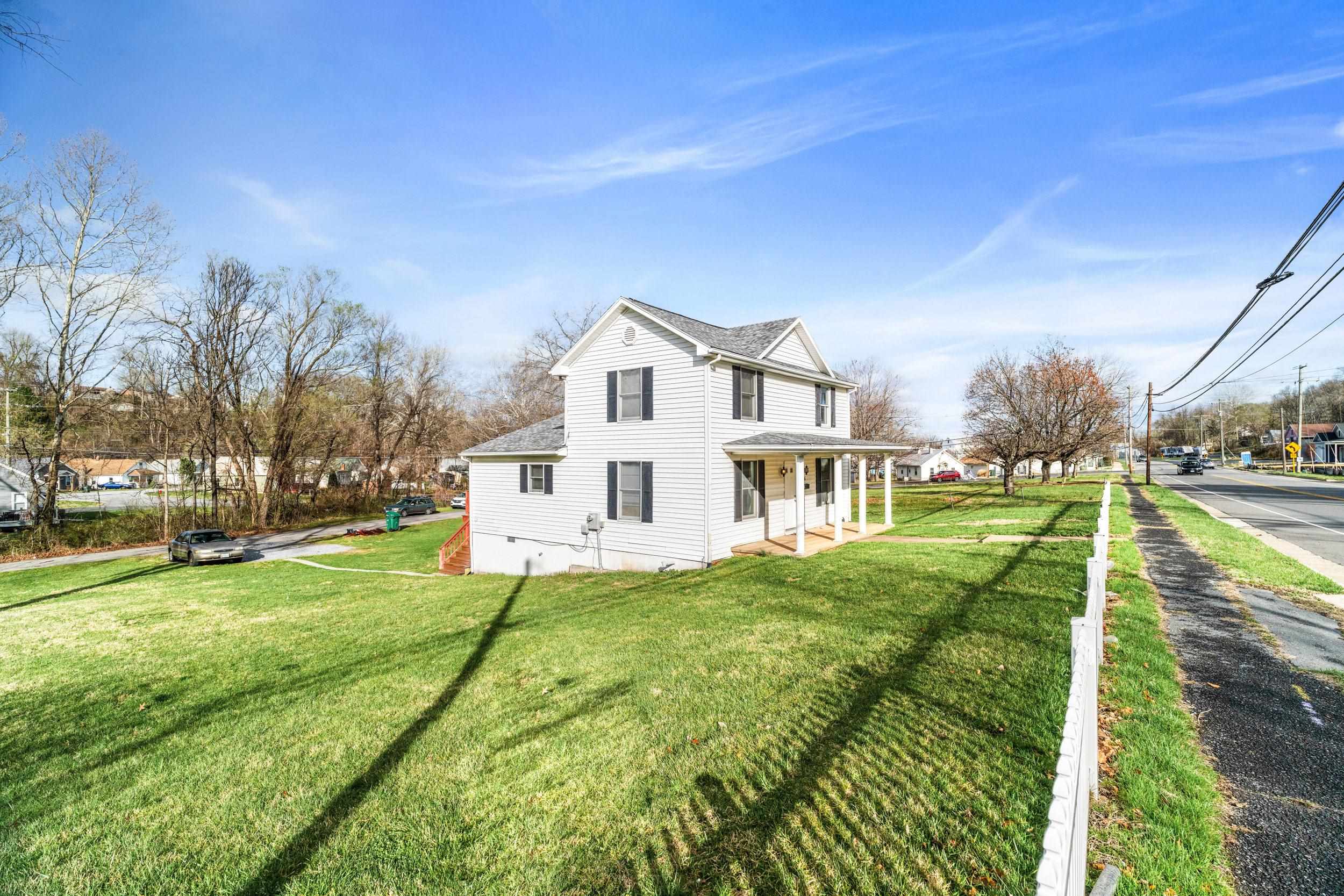 1316 East Main Street Waynesboro, VA 22980 - Photo 32 of 34 a view of a house with a big yard and potted plants