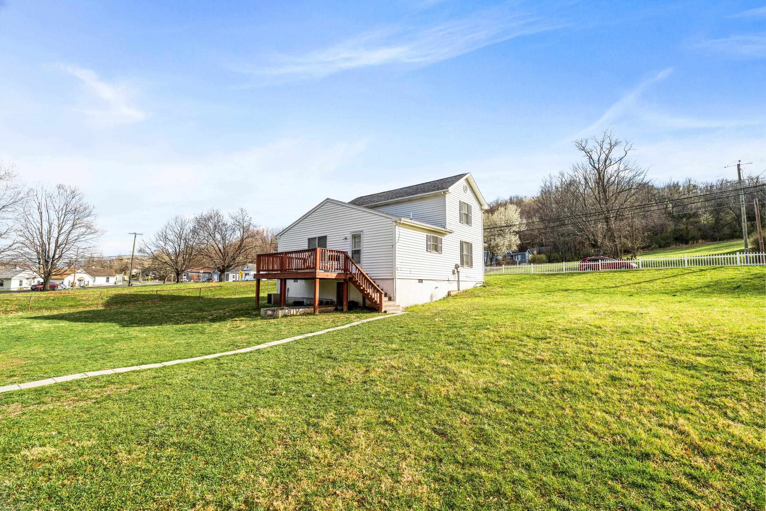 1316 East Main Street Waynesboro, VA 22980 - Photo 34 of 34 a view of a house with a big yard and palm trees