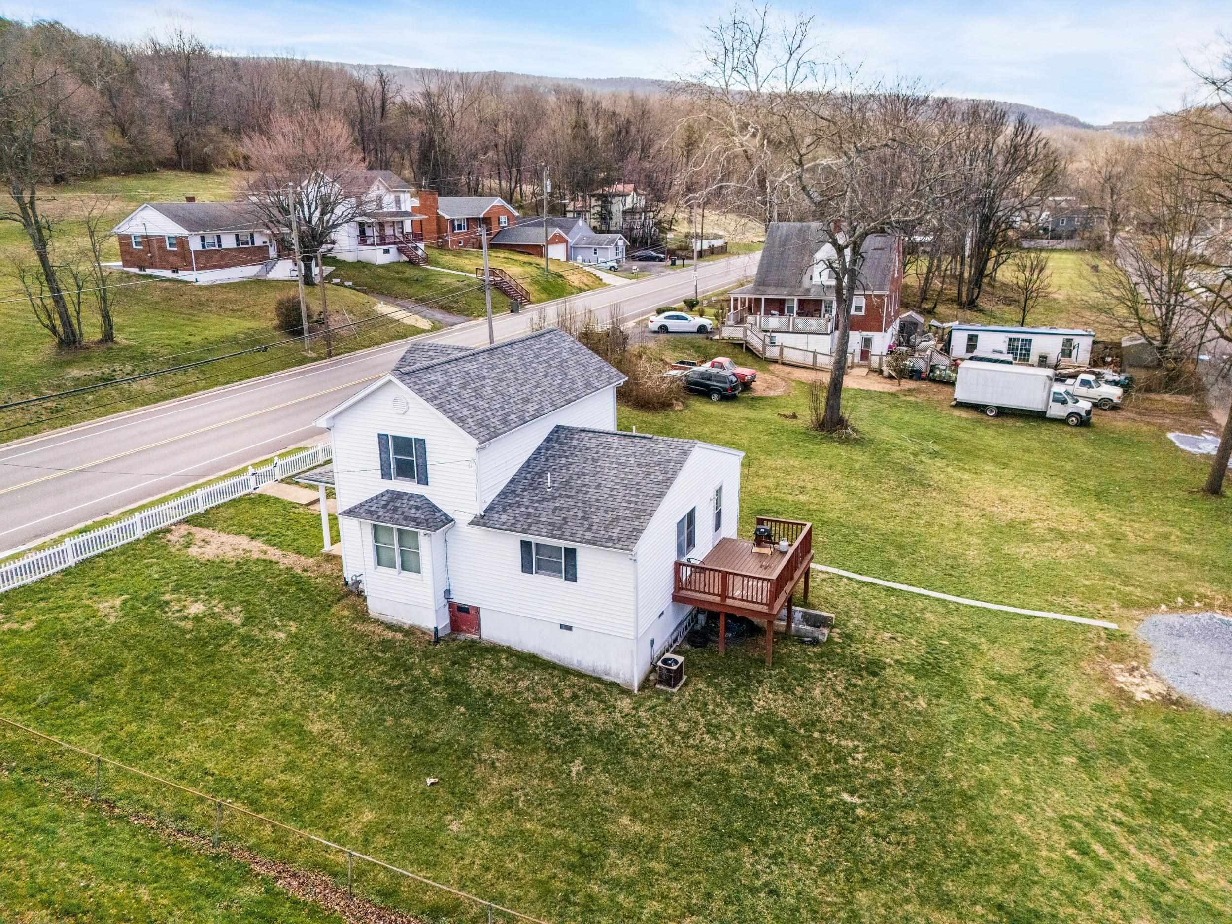 1316 East Main Street Waynesboro, VA 22980 - Photo 7 of 34 a aerial view of a house with swimming pool garden view and a lake view