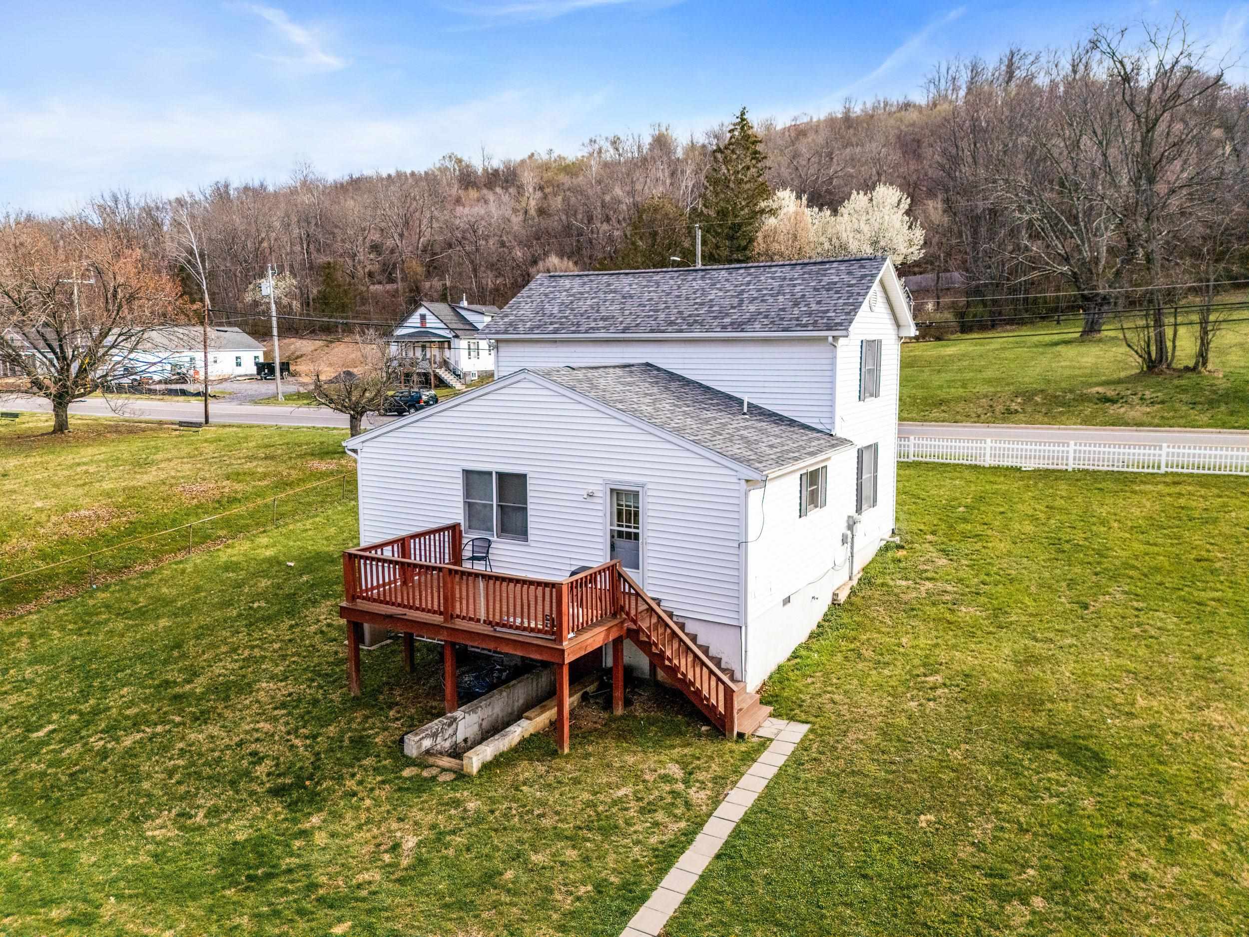 1316 East Main Street Waynesboro, VA 22980 - Photo 8 of 34 a view of a house with a yard porch and sitting area
