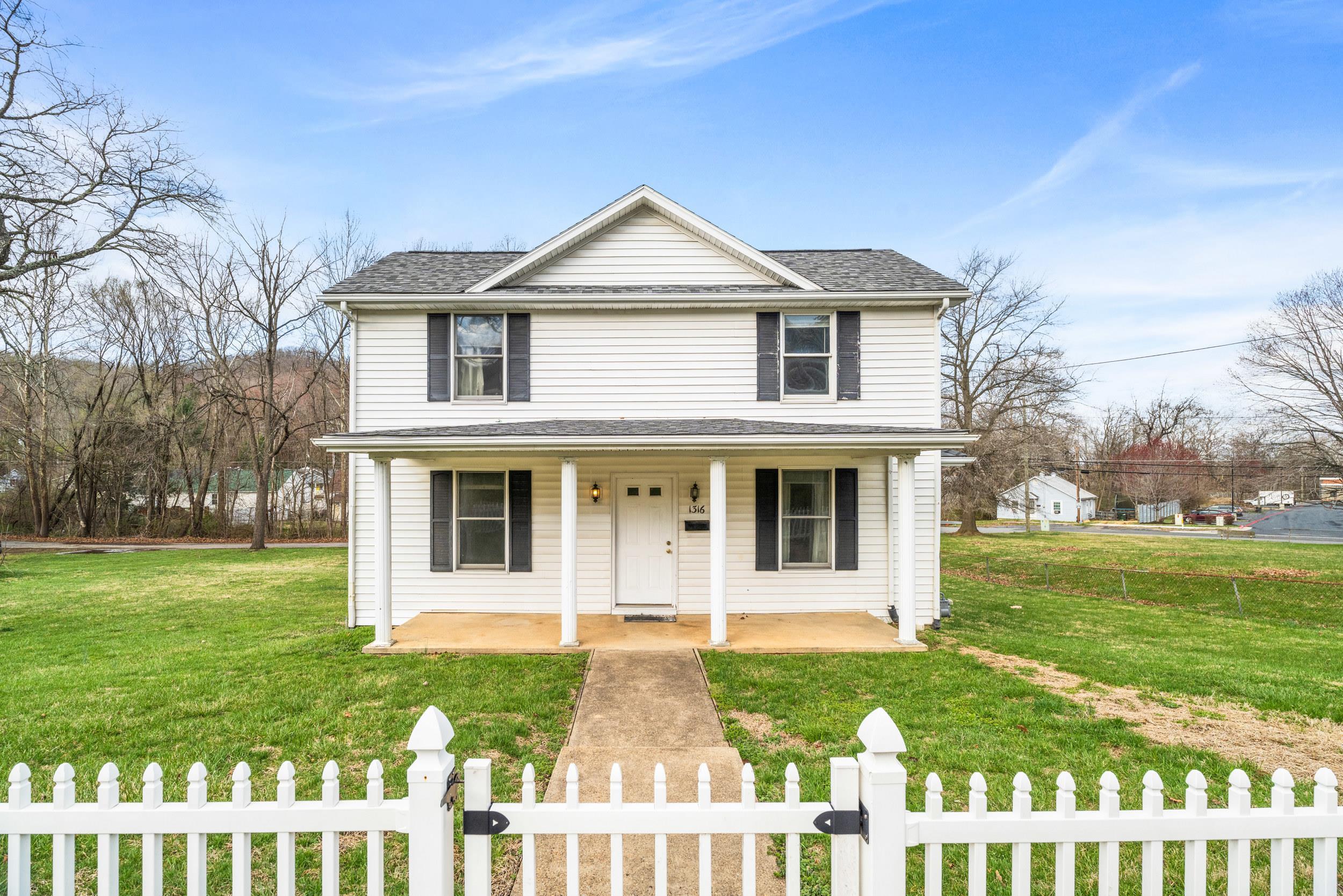 1316 East Main Street Waynesboro, VA 22980 - Photo 9 of 34 a front view of a house with a yard
