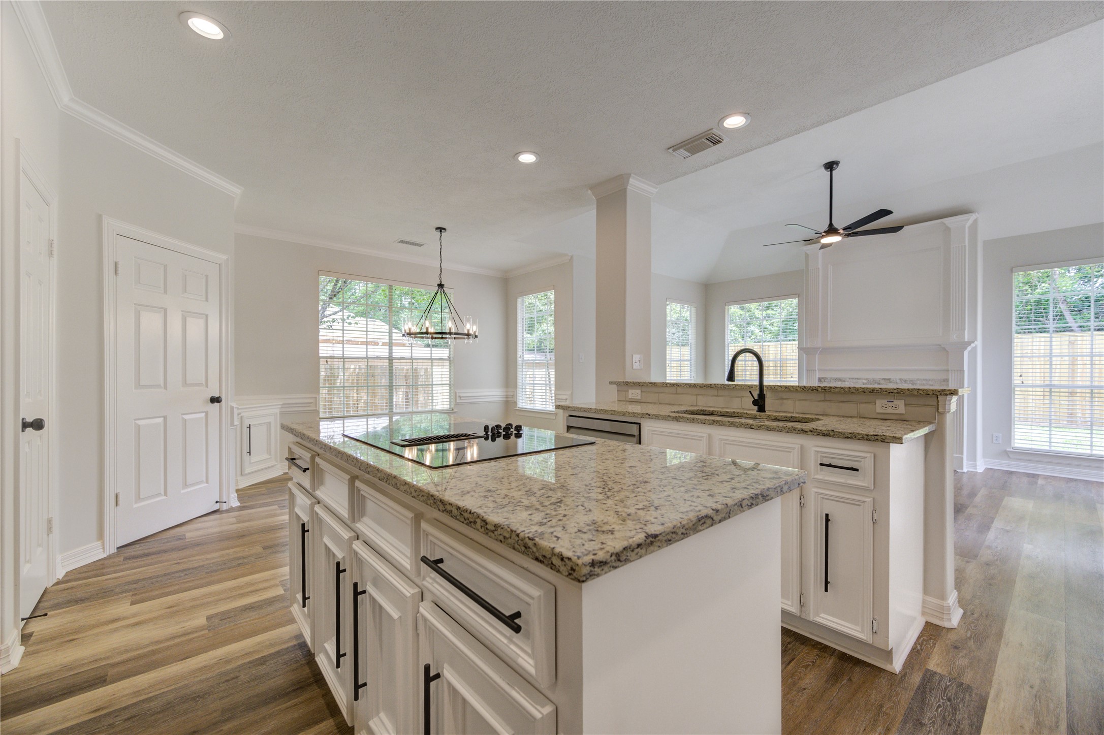 17318 Bonnard Circle Spring, TX 77379 - Photo 20 of 45 The kitchen features new appliances, new granite,and a new backsplash. In this view, you can see the brand new down-draft cooktop.