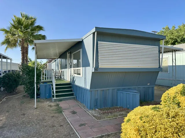 a view of balcony with furniture