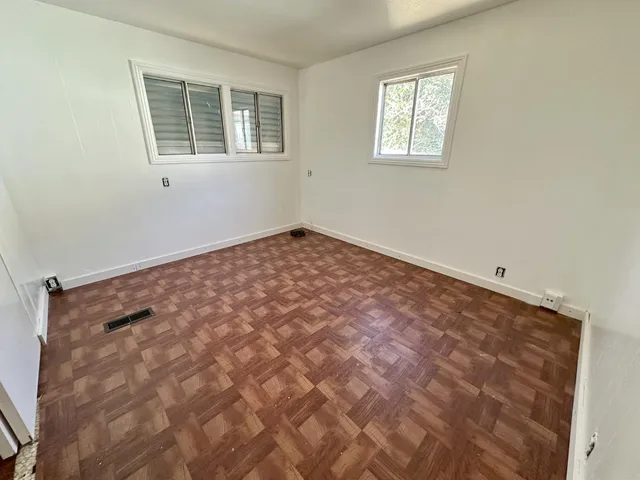 a view of empty room with windows