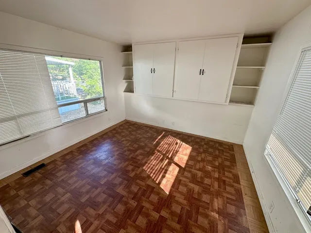 a view of an empty room and window