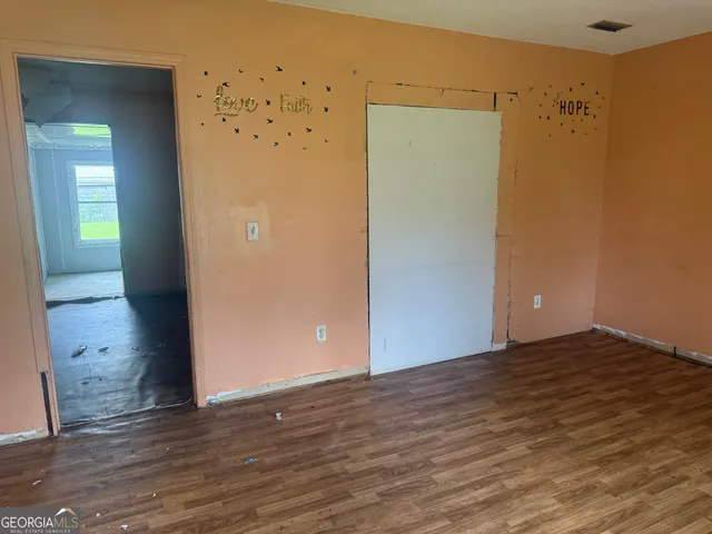 a view of a big room with wooden floor