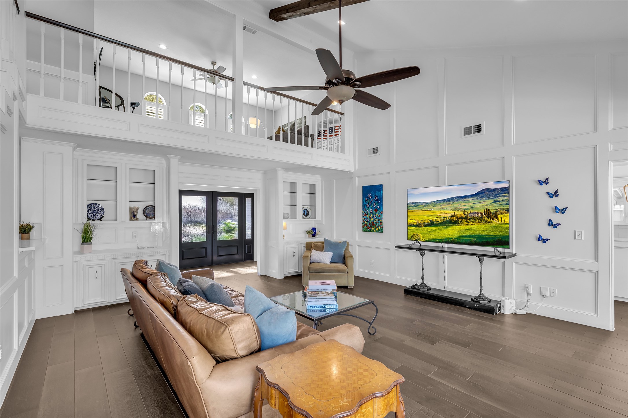 9318 Appin Falls Drive Spring, TX 77379 - Photo 16 of 35 a living room with furniture a flat screen tv and a wooden floor