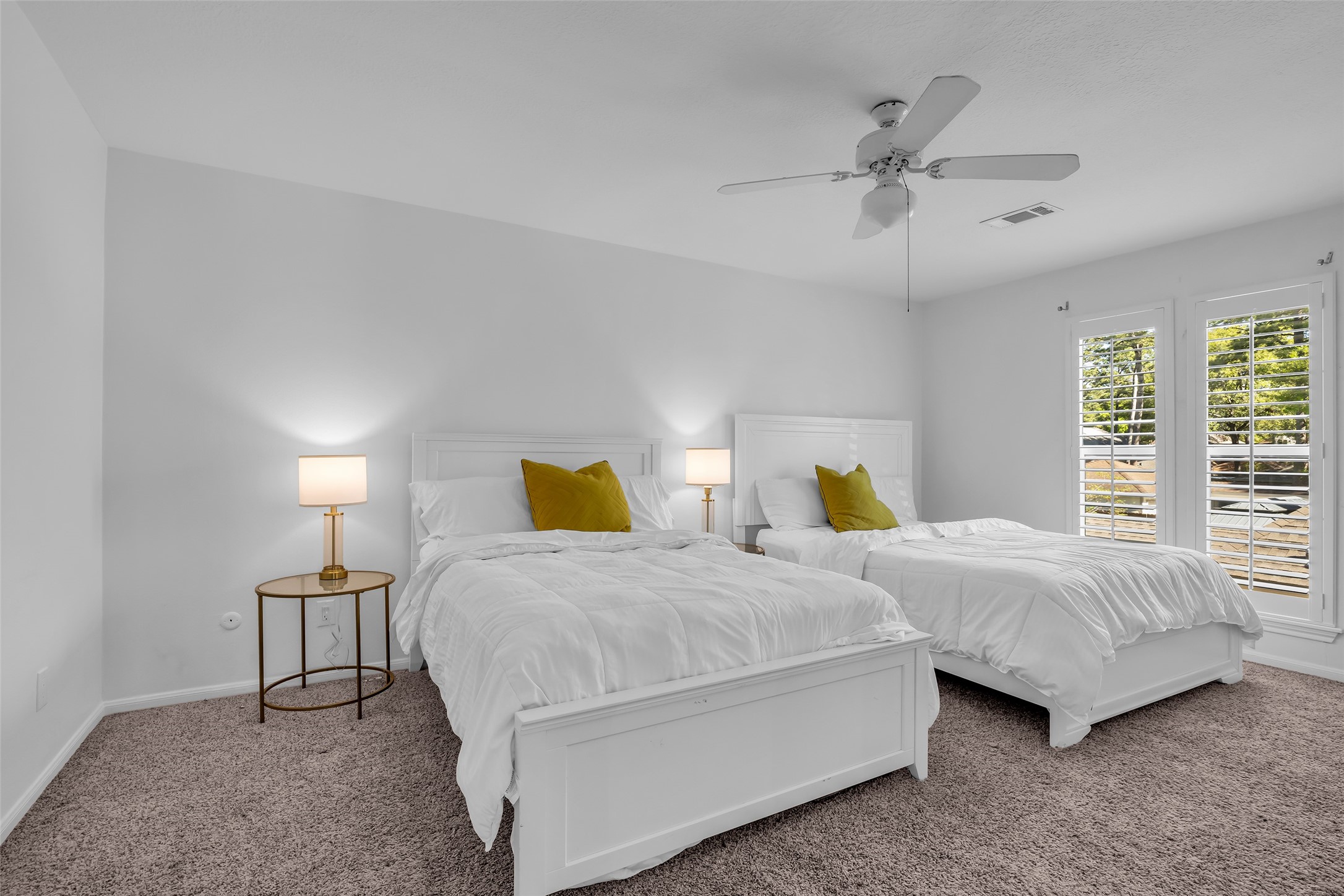 9318 Appin Falls Drive Spring, TX 77379 - Photo 26 of 35 a bedroom with two beds and painting on the wall