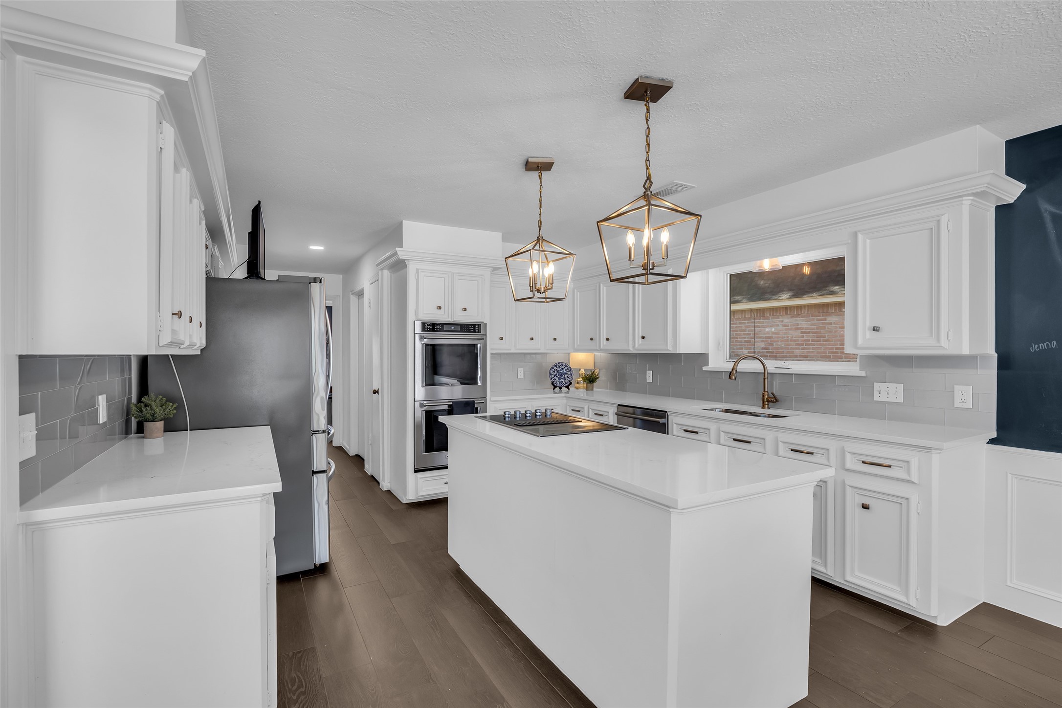 9318 Appin Falls Drive Spring, TX 77379 - Photo 8 of 35 a kitchen that has a lot of cabinets and refrigerator
