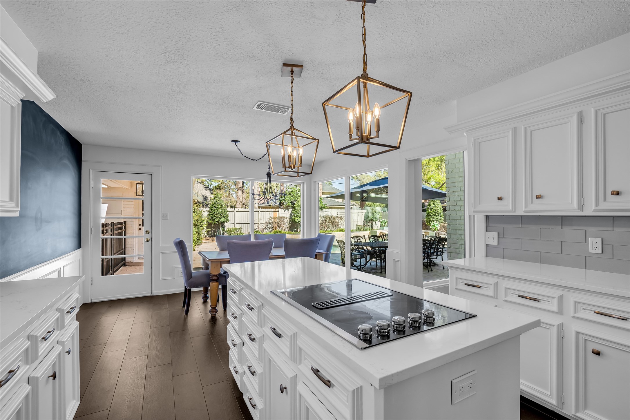 9318 Appin Falls Drive Spring, TX 77379 - Photo 10 of 35 a kitchen with stainless steel appliances granite countertop a sink a stove and a wooden floors