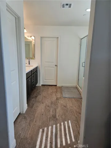 a white toilet sitting next to a sink
