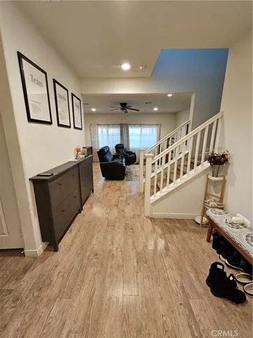 a view of a kitchen with furniture and a wooden floor
