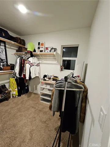 a view of a hallway with wooden walls and stairs