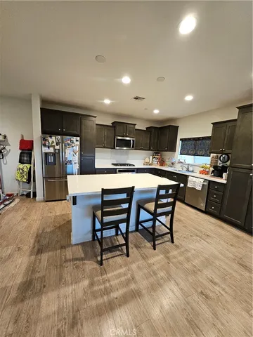 a kitchen with a table and chairs in it