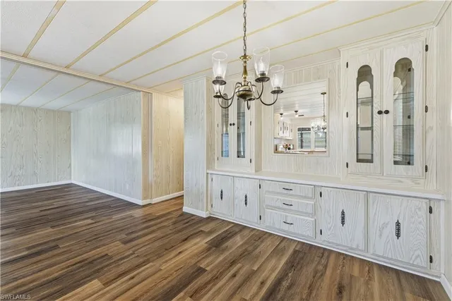 a view of a hallway with chandelier