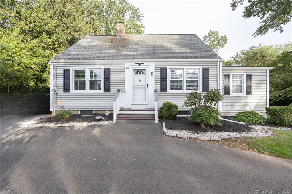 389 Long Hill Road Wallingford, CT 06492 - Photo 1 of 1 a front view of a house with a yard and potted plants