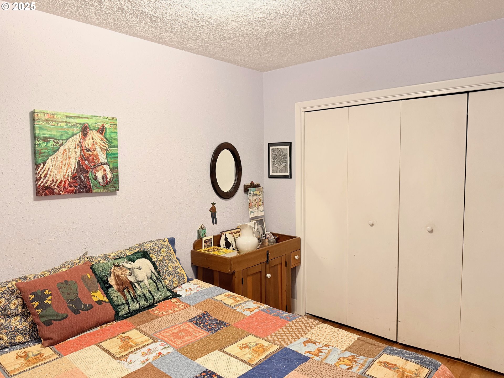 114 Maple Boulevard Wood Village, OR 97060 - Photo 11 of 23 a bedroom with bed and a painting on the wall