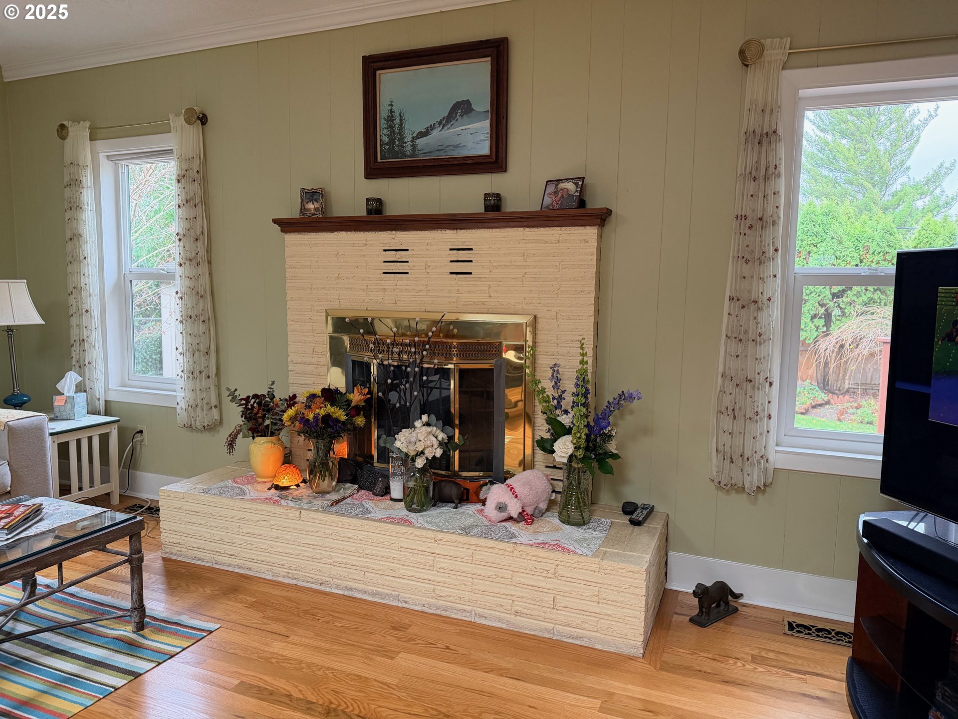114 Maple Boulevard Wood Village, OR 97060 - Photo 2 of 23 a view of a livingroom with fireplace and a window