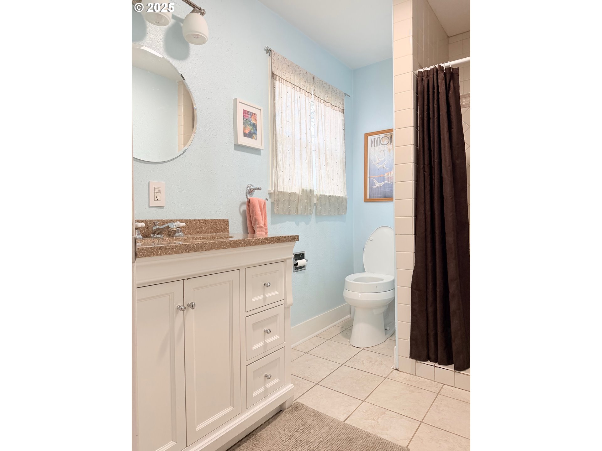 114 Maple Boulevard Wood Village, OR 97060 - Photo 3 of 23 a bathroom with a sink a toilet and a mirror