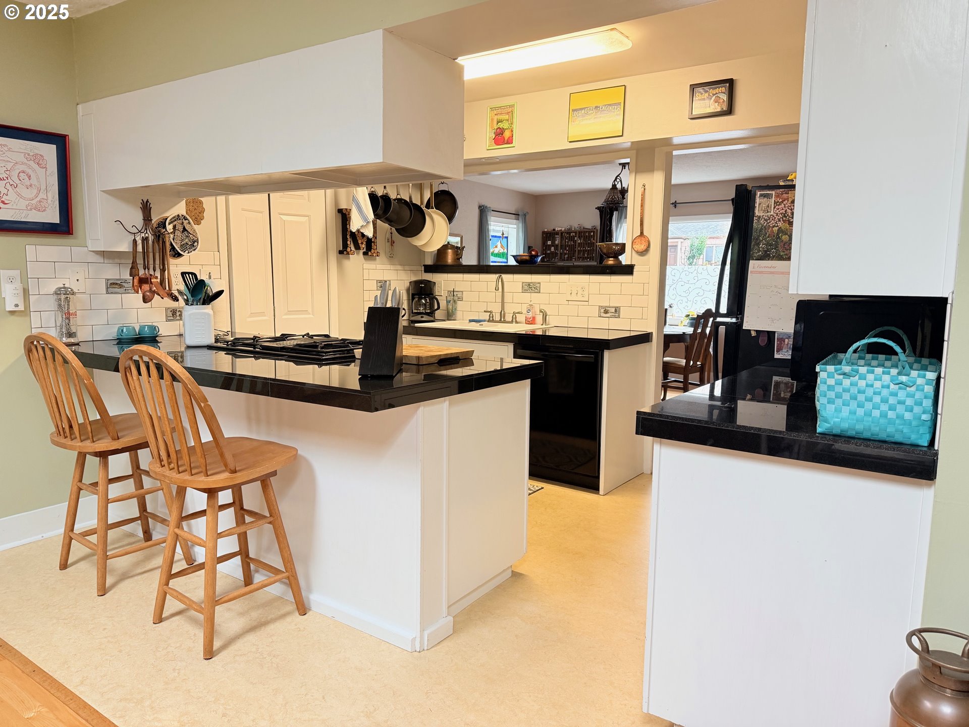 114 Maple Boulevard Wood Village, OR 97060 - Photo 6 of 23 a kitchen with stainless steel appliances granite countertop a stove a sink and a microwave