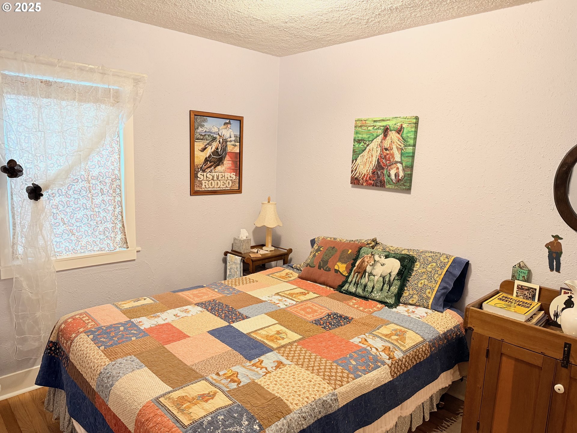 114 Maple Boulevard Wood Village, OR 97060 - Photo 10 of 23 a bedroom with a bed and painting on the wall