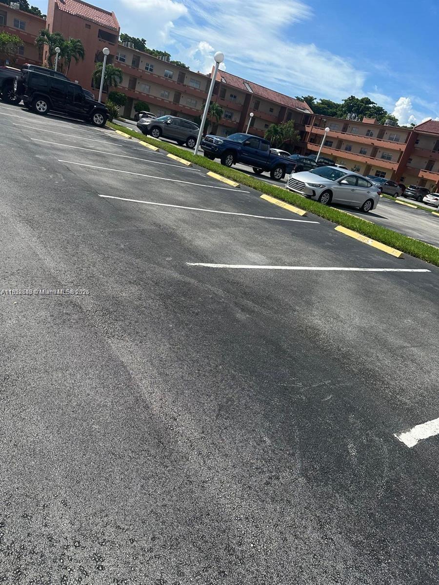 8834 West McNab Road, Unit 302 Tamarac, FL 33321 - Photo 24 of 25 a view of street with cars