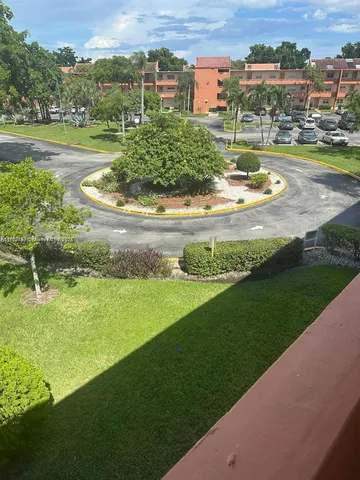 a view of a lake with a houses yard and ocean view