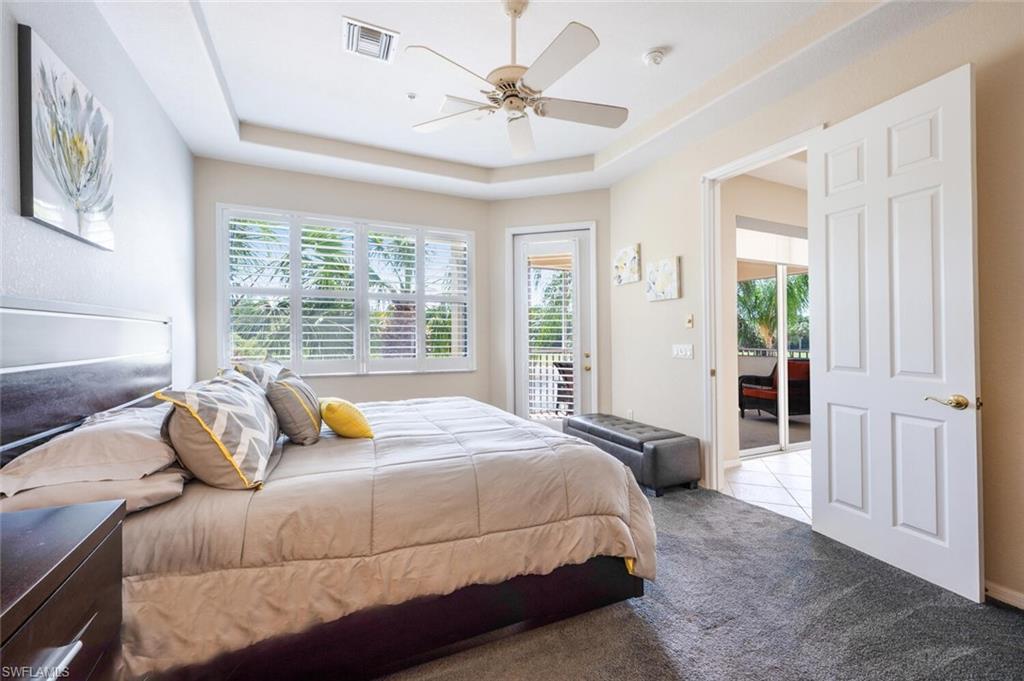 4630 Winged Foot Court, Unit 202 Naples, FL 34112 - Photo 19 of 32 Carpeted bedroom with visible vents, access to outside, and ceiling fan