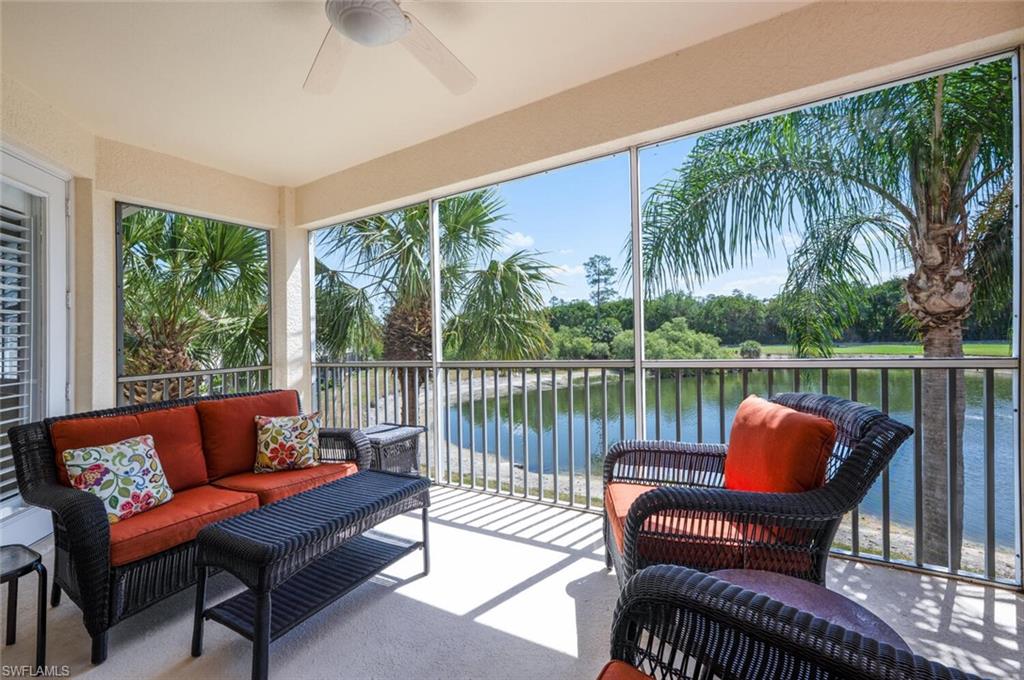 4630 Winged Foot Court, Unit 202 Naples, FL 34112 - Photo 23 of 32 Sunroom / solarium featuring outdoor lounge area, a ceiling fan, and a water view