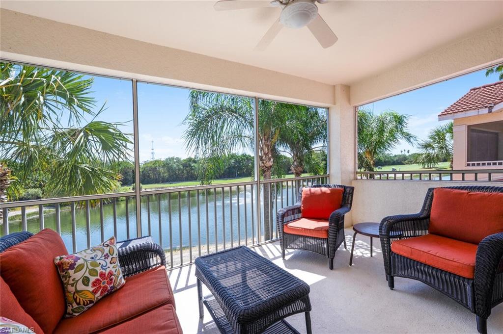 4630 Winged Foot Court, Unit 202 Naples, FL 34112 - Photo 24 of 32 Sunroom with ceiling fan, a water view, and outdoor lounge area