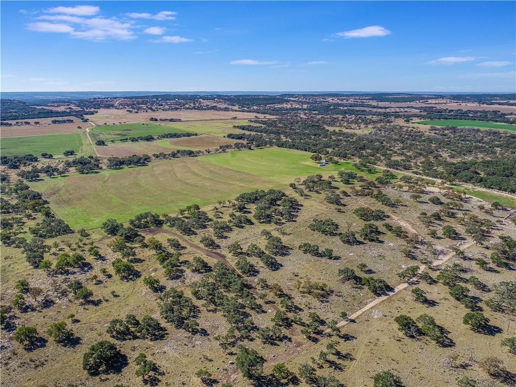 788 Clarence Jacoby Road Fredericksburg, TX 78624 - Photo 11 of 14 a view of a large body of water with lots of trees in the background