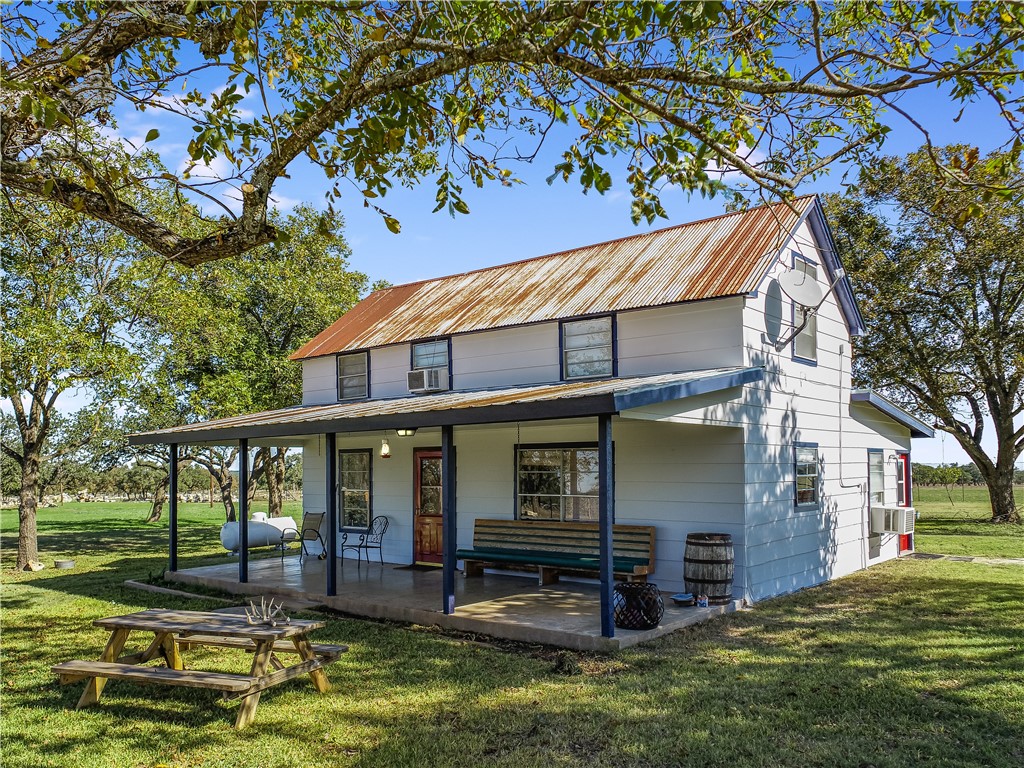 788 Clarence Jacoby Road Fredericksburg, TX 78624 - Photo 6 of 14 a view of a house with backyard porch and sitting area