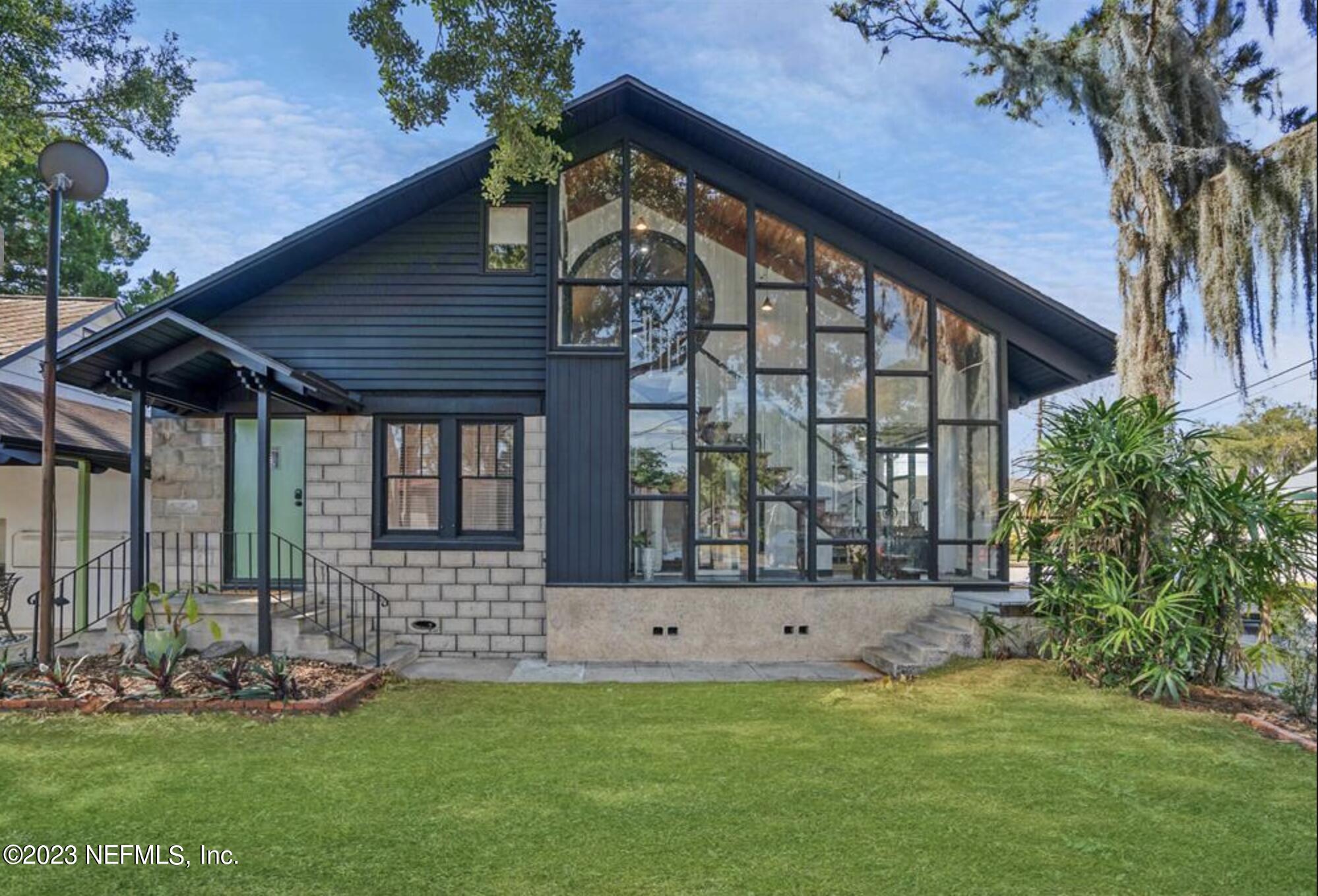 10 Pacific Street St. Augustine, FL 32084 - Photo 1 of 1 a front view of house with yard and outdoor seating