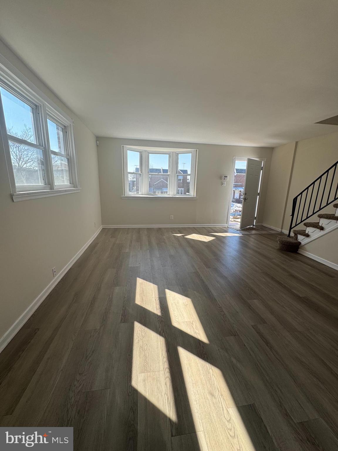 4215 Lansing Street Philadelphia, PA 19136 - Photo 6 of 14 a view of an empty room with wooden floor and a window