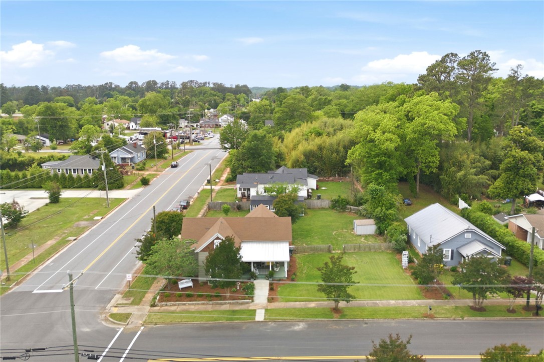 314 South Fairplay Street Seneca, SC 29678 - Photo 46 of 50 An aerial view captures the neighborhood's layout, with a house featuring a classic roof and a spacious yard.