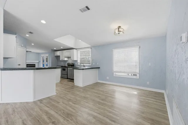 a view of kitchen with wooden floor