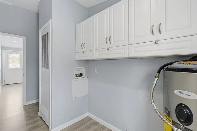 a view of storage and utility room with washer and dryer