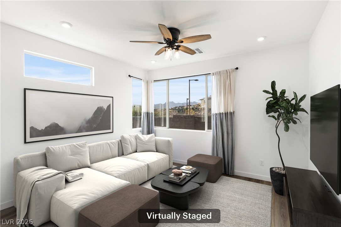 633 Infinity Rdg Street Las Vegas, NV 89138 - Photo 8 of 36 Living area featuring wood finished floors, a ceiling fan, plenty of natural light, and recessed lighting