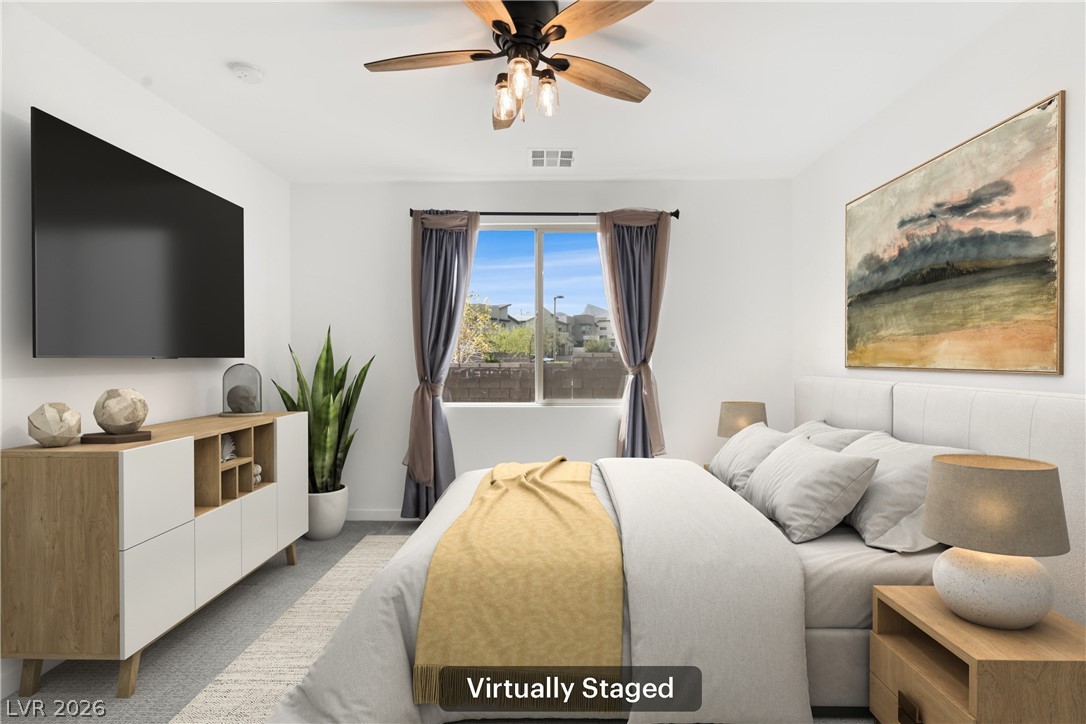 633 Infinity Rdg Street Las Vegas, NV 89138 - Photo 9 of 36 Carpeted bedroom featuring a ceiling fan