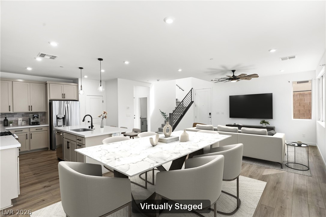 633 Infinity Rdg Street Las Vegas, NV 89138 - Photo 3 of 36 Dining room featuring recessed lighting, light wood-style flooring, and a ceiling fan