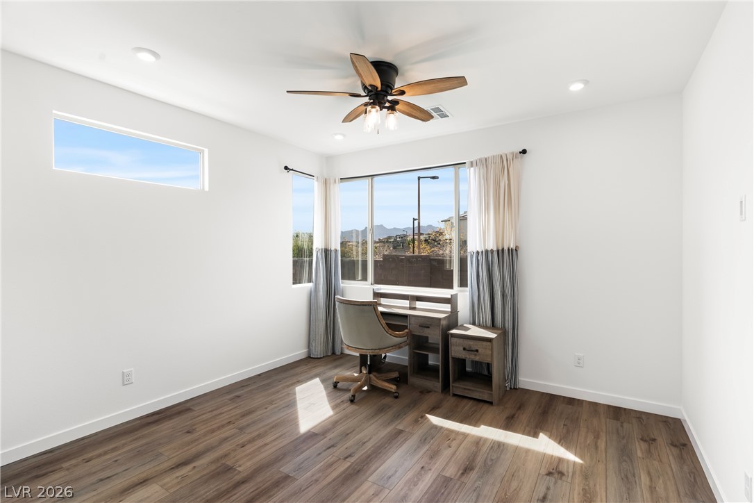 633 Infinity Rdg Street Las Vegas, NV 89138 - Photo 7 of 36 Home office featuring dark wood-style floors, a ceiling fan, and recessed lighting