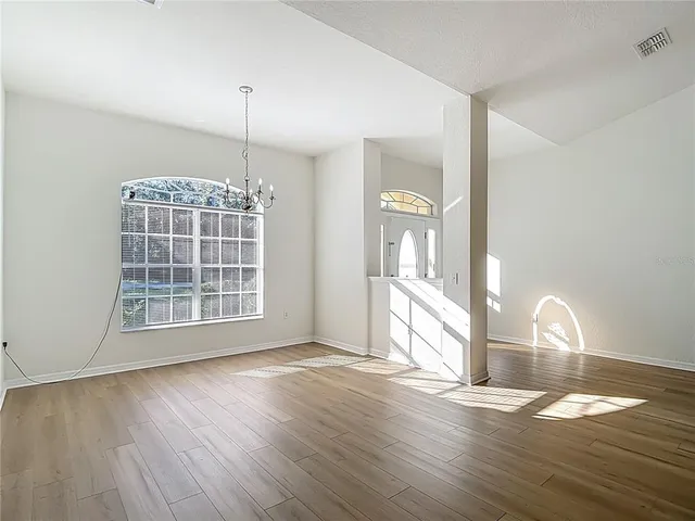 a kitchen with stainless steel appliances granite countertop a refrigerator stove and sink