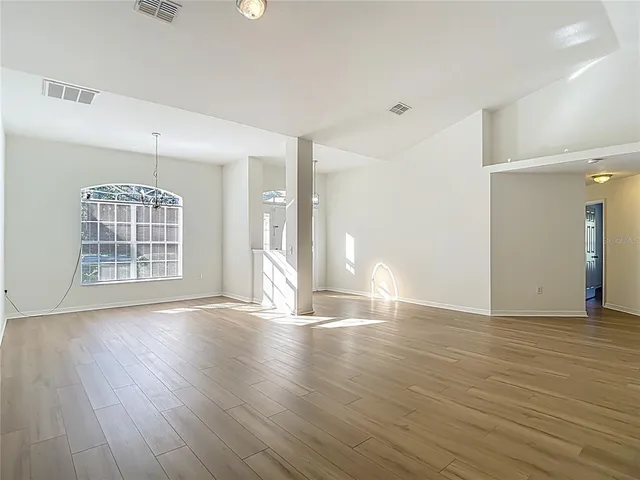 a kitchen with stainless steel appliances granite countertop a refrigerator stove microwave and sink