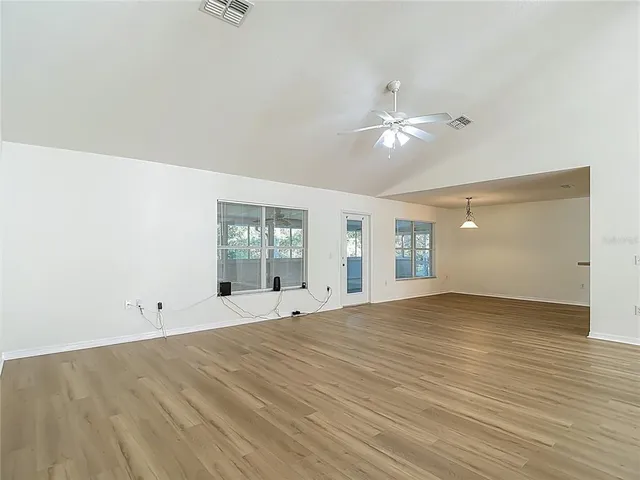 a kitchen with granite countertop cabinets stainless steel appliances and wooden cabinets