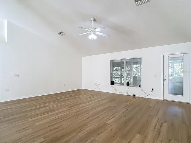 a kitchen with stainless steel appliances granite countertop a refrigerator stove and sink